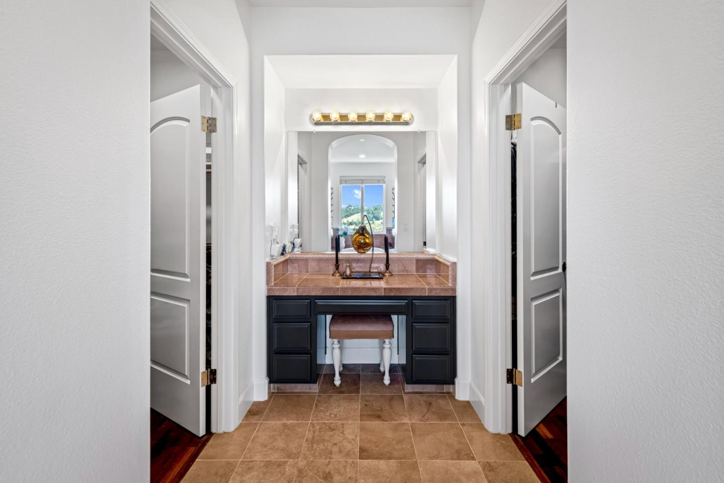 1913 St Andrews Circle Gilroy, CA 95020 - Photo 58 of 79 a hallway with a sink and a mirror in it