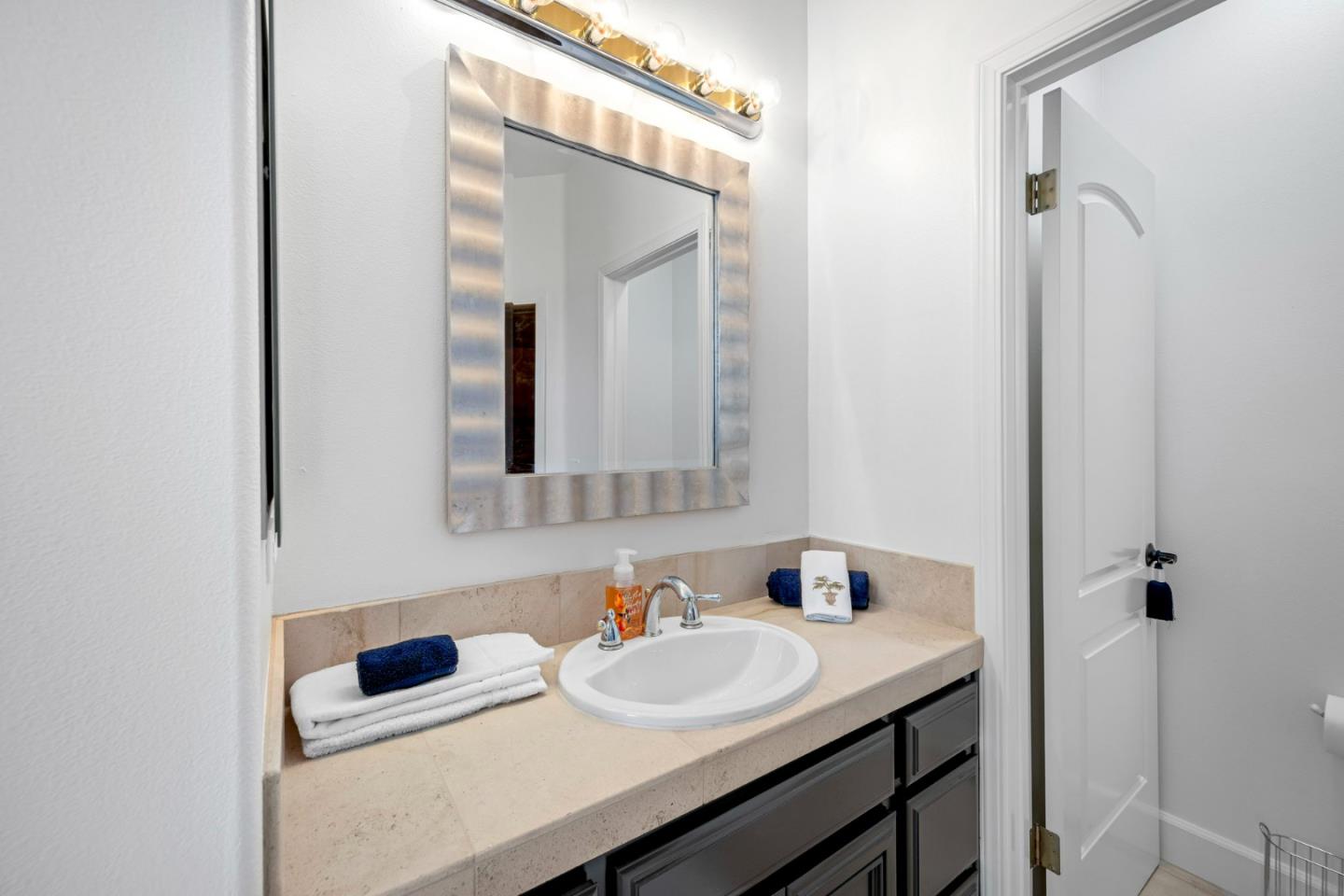 1913 St Andrews Circle Gilroy, CA 95020 - Photo 63 of 79 a bathroom with a sink and a mirror