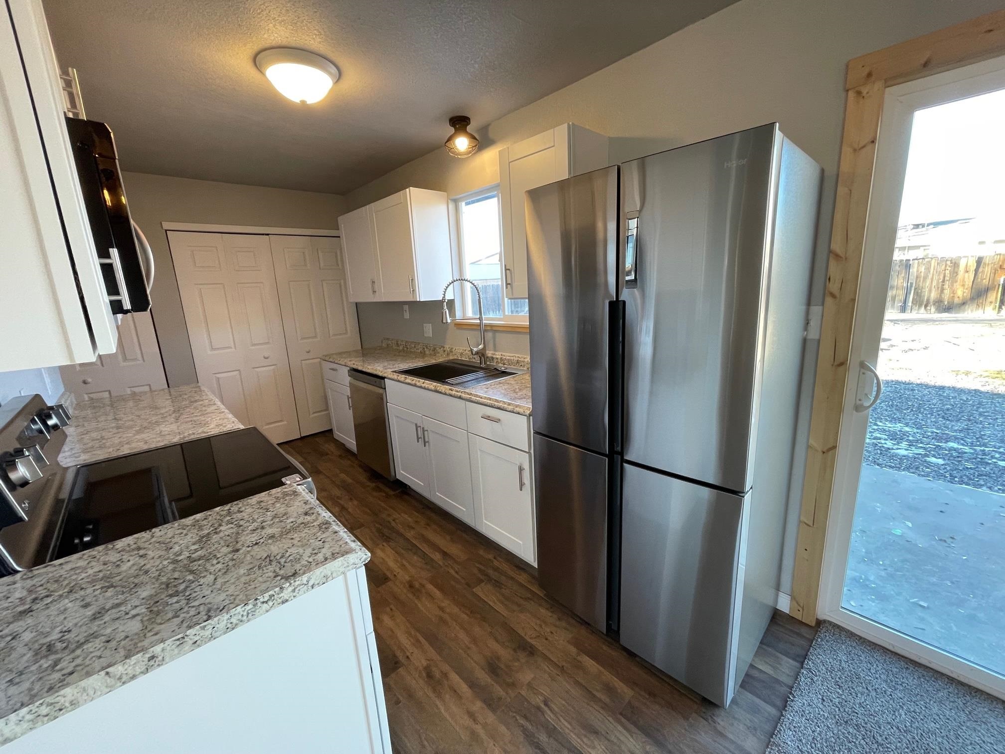 3206 D D 1/4 Road Clifton, CO 81520 - Photo 11 of 39 a kitchen with a refrigerator sink and stove
