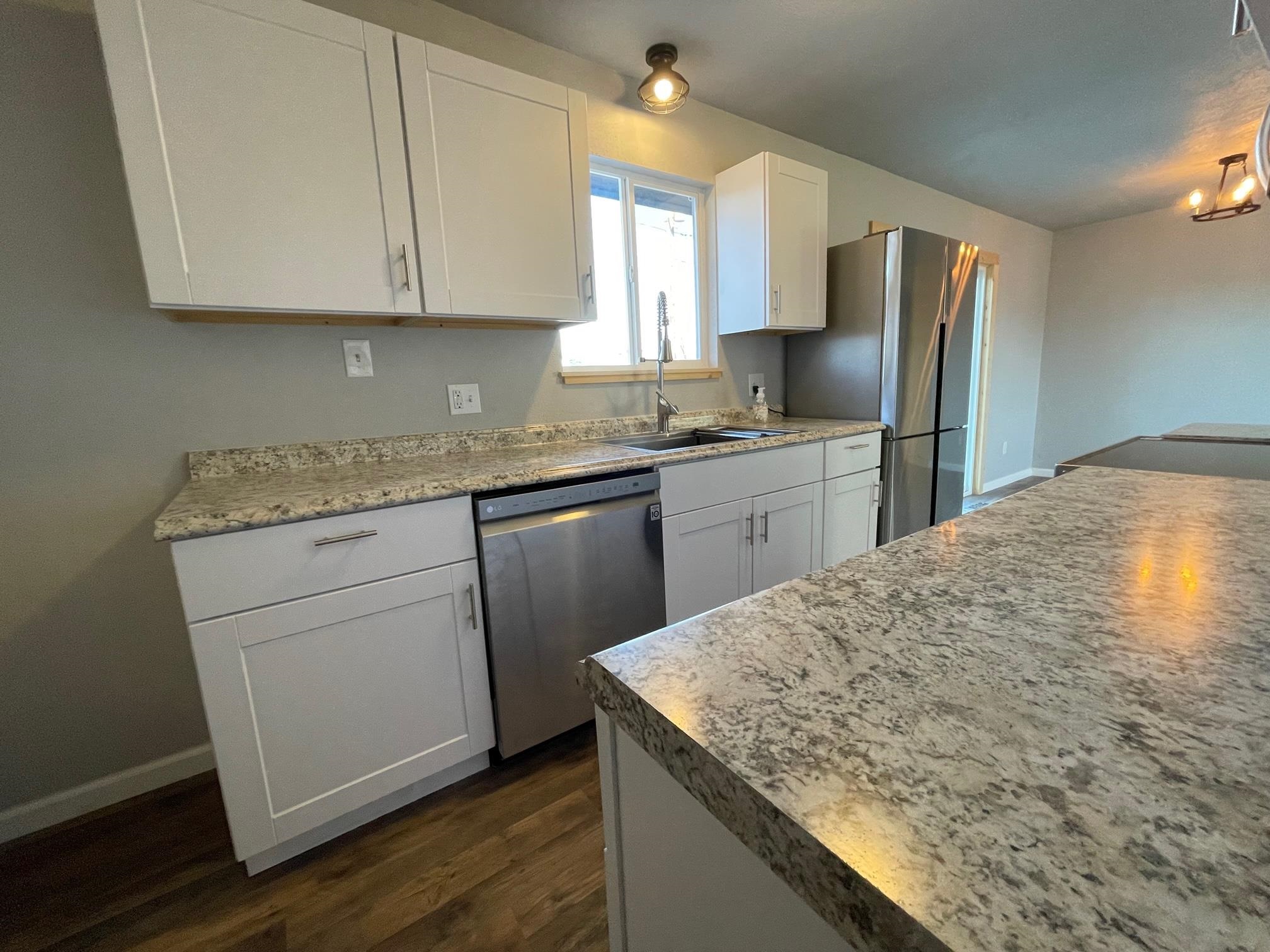 3206 D D 1/4 Road Clifton, CO 81520 - Photo 13 of 39 a kitchen with stainless steel appliances granite countertop a sink stove and refrigerator