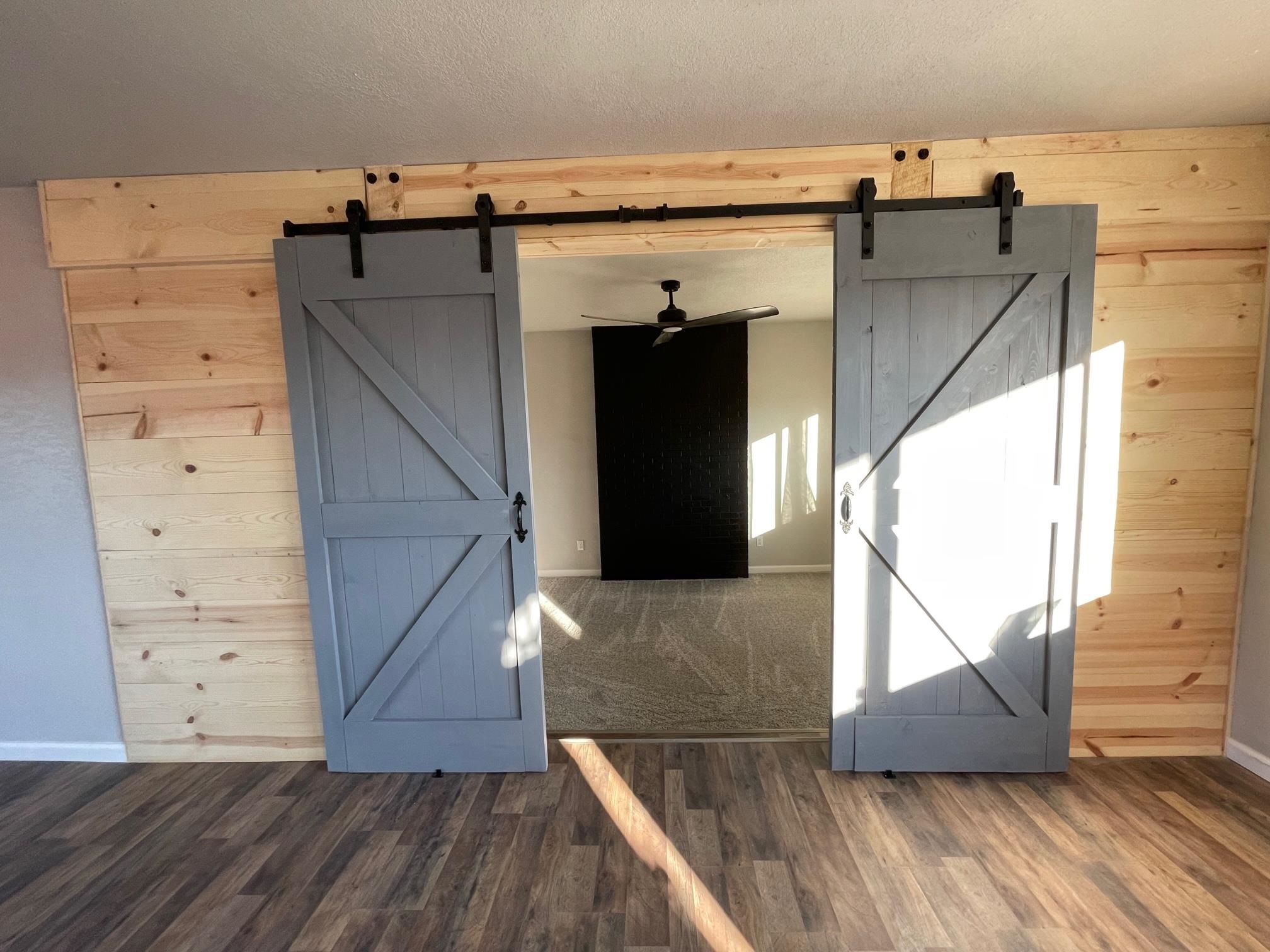 3206 D D 1/4 Road Clifton, CO 81520 - Photo 20 of 39 a view of a hallway with wooden floor and staircase