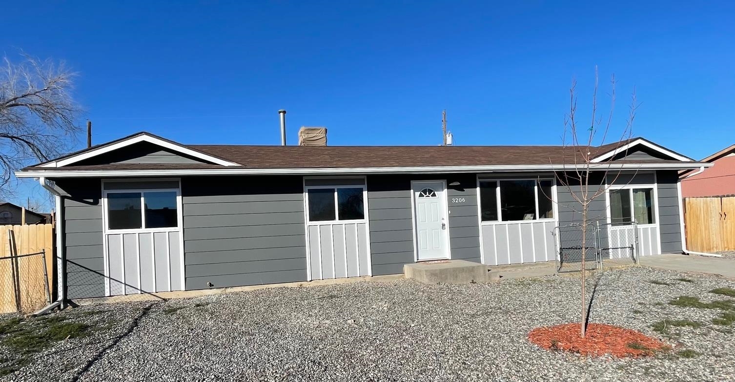 3206 D D 1/4 Road Clifton, CO 81520 - Photo 2 of 39 a front view of a house with a yard