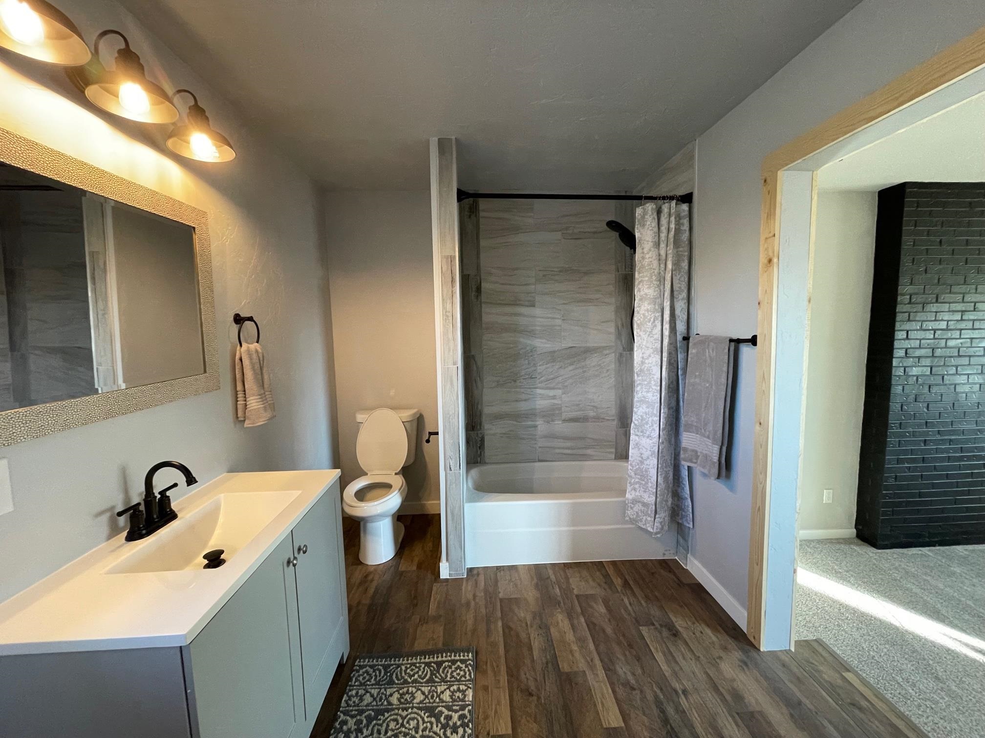 3206 D D 1/4 Road Clifton, CO 81520 - Photo 26 of 39 a bathroom with a sink a toilet and shower