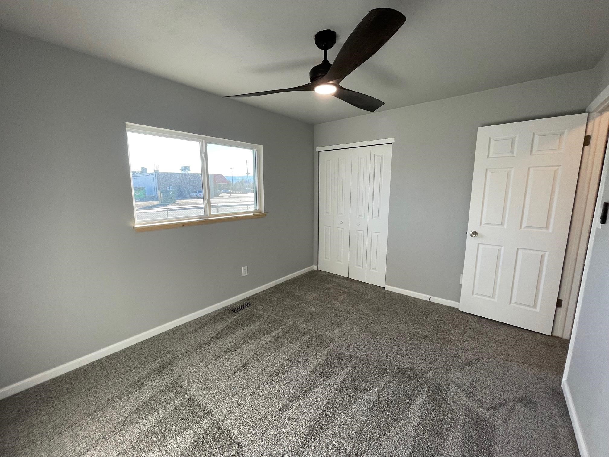 3206 D D 1/4 Road Clifton, CO 81520 - Photo 29 of 39 a view of an empty room with a window