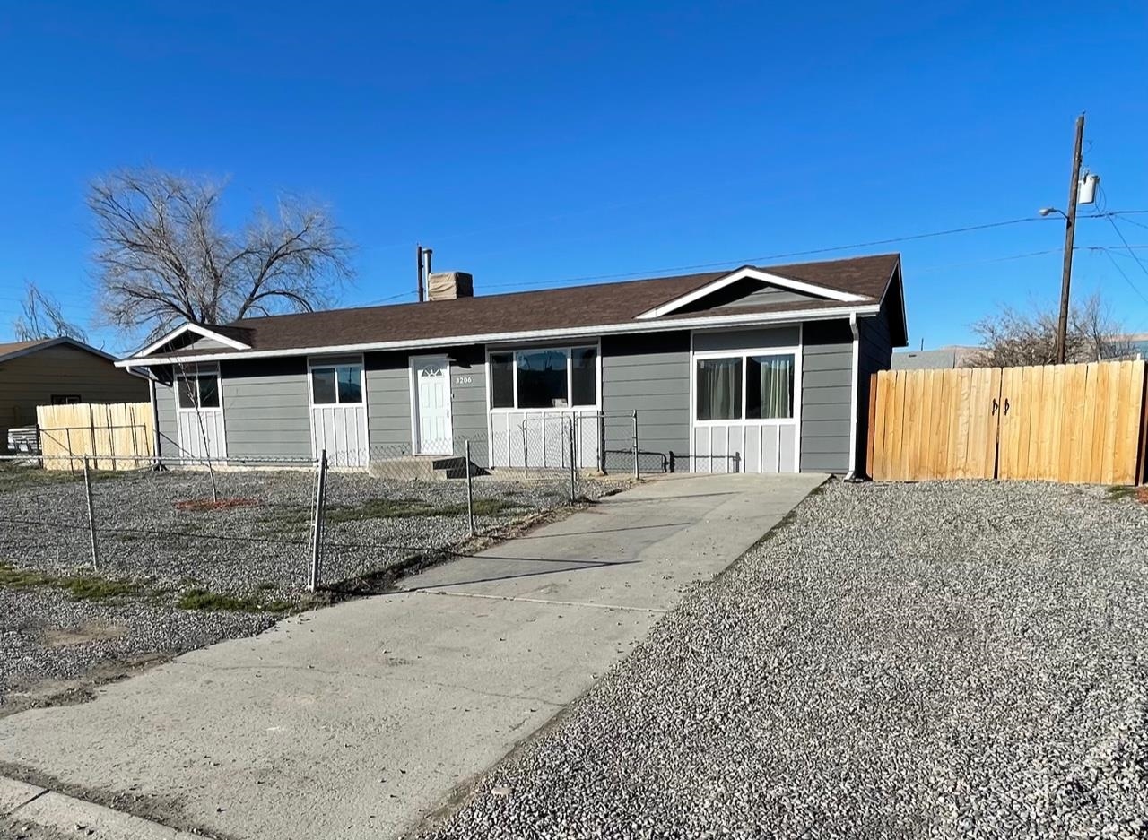 3206 D D 1/4 Road Clifton, CO 81520 - Photo 3 of 39 a front view of a house with a garden