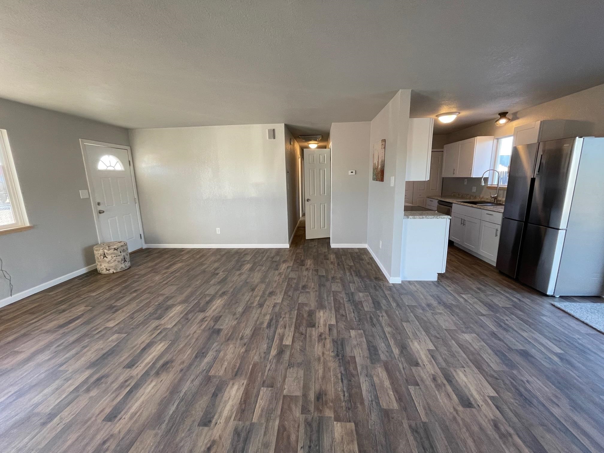 3206 D D 1/4 Road Clifton, CO 81520 - Photo 6 of 39 a view of empty room with wooden floor