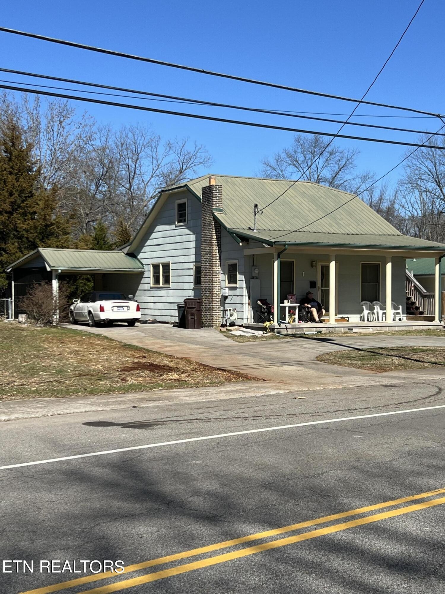 306 Englewood Road Madisonville, TN 37354 - Photo 1 of 34 a view of a house with a patio