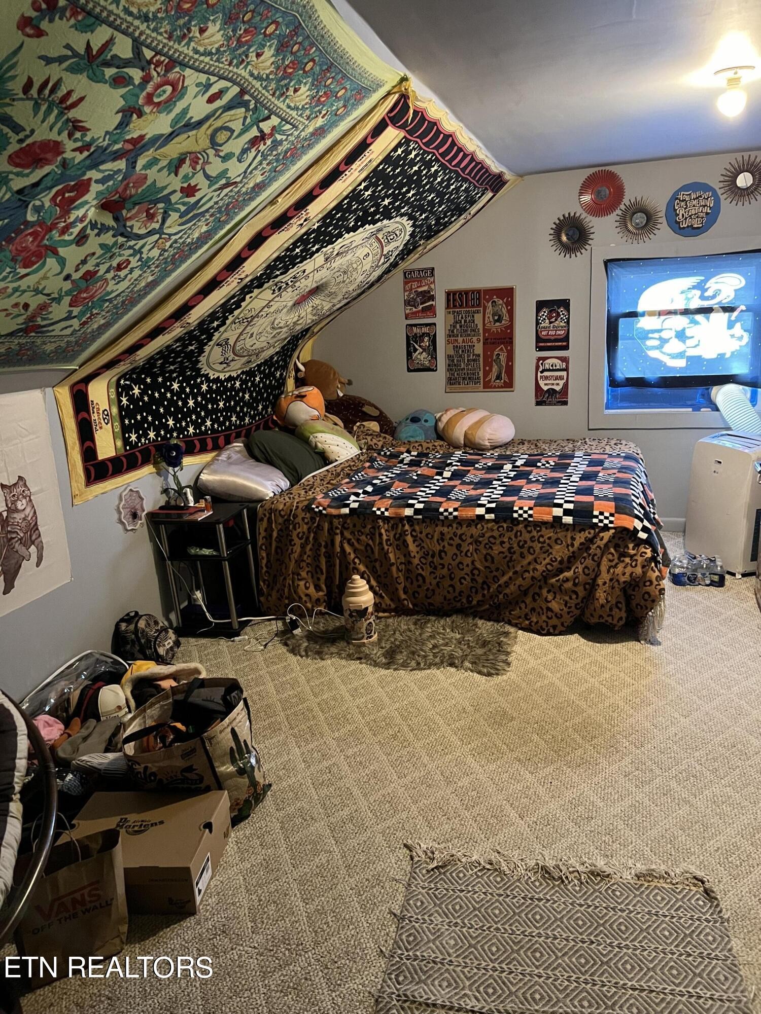 306 Englewood Road Madisonville, TN 37354 - Photo 17 of 34 a bed room with a bed and a tv