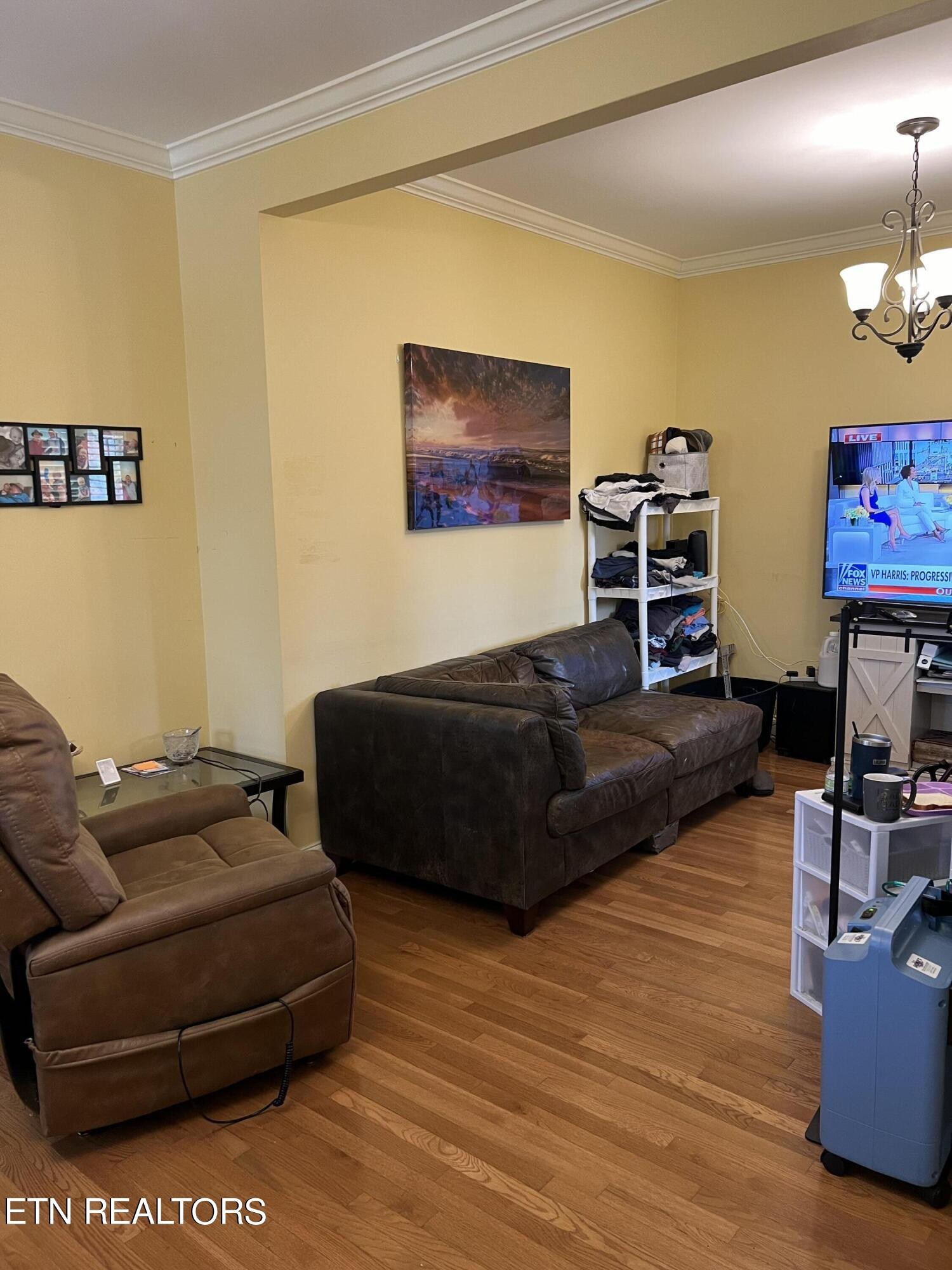 306 Englewood Road Madisonville, TN 37354 - Photo 29 of 34 a living room with furniture and a flat screen tv