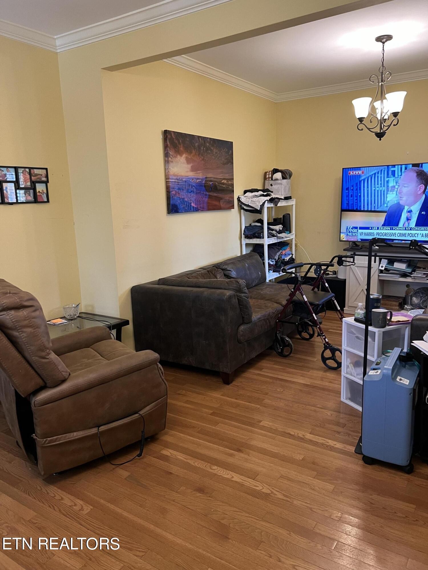 306 Englewood Road Madisonville, TN 37354 - Photo 30 of 34 a living room with furniture a flat screen tv and a lamp