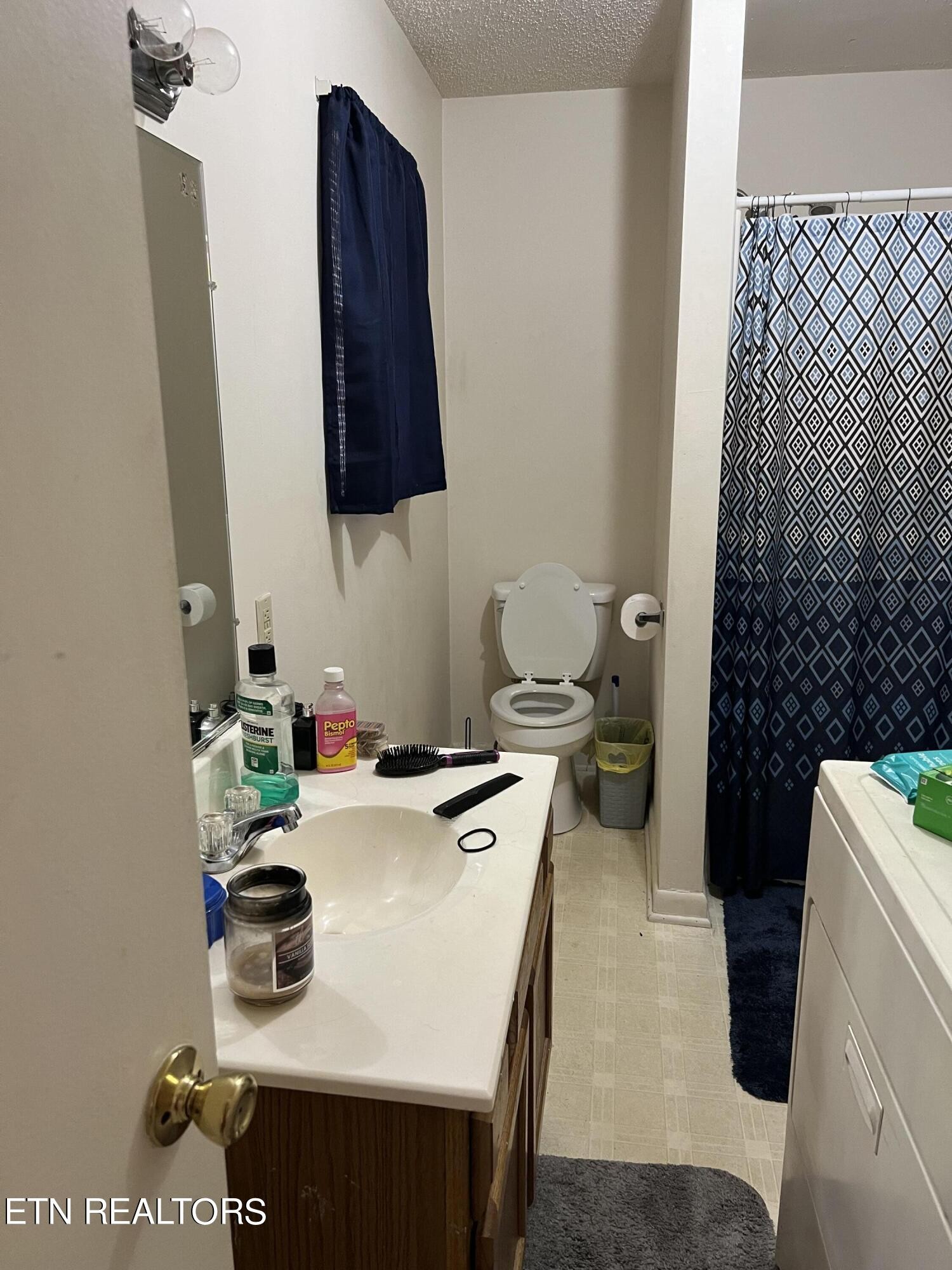 306 Englewood Road Madisonville, TN 37354 - Photo 32 of 34 a room with a sink and a stove with wooden floor