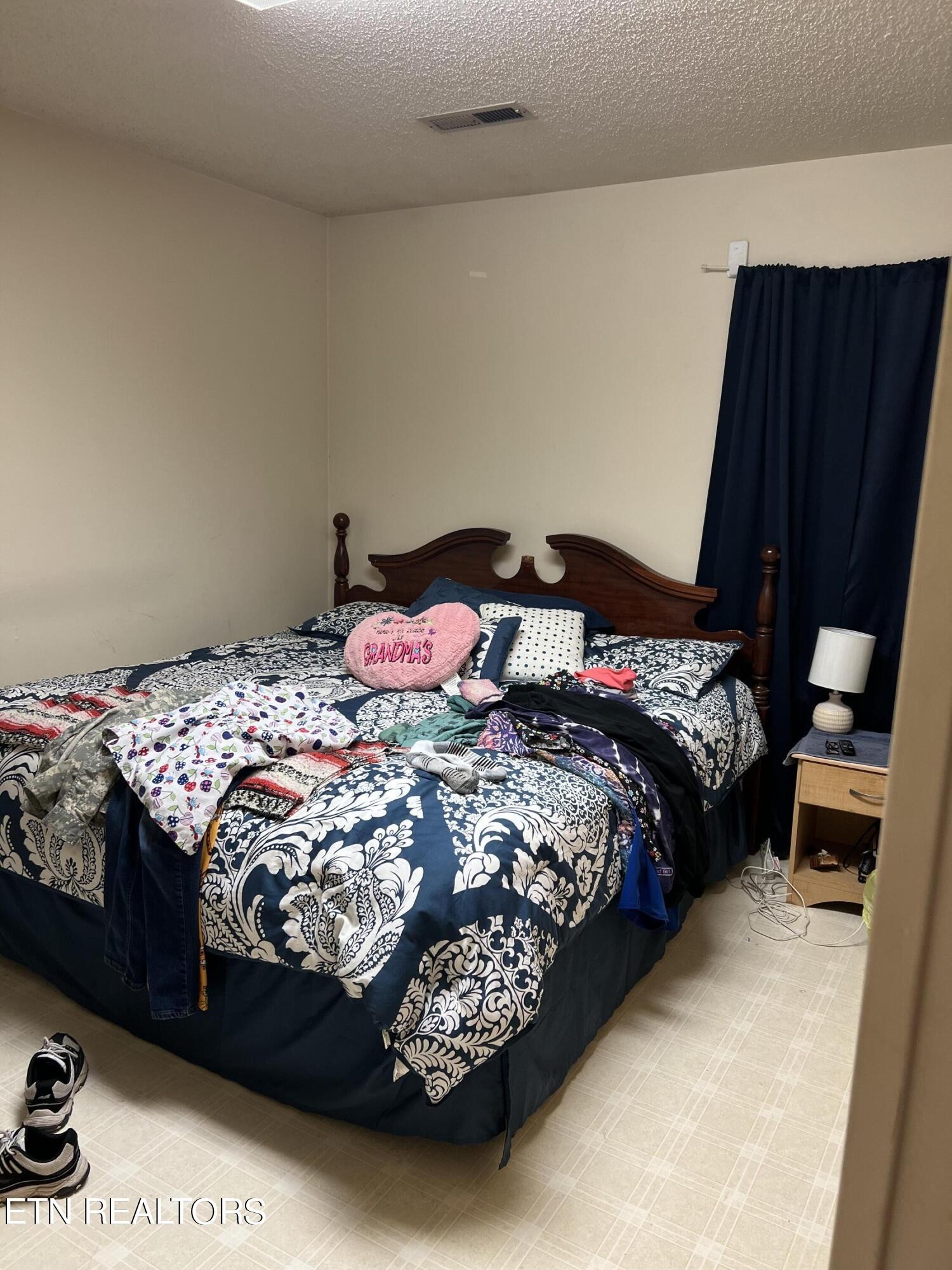 306 Englewood Road Madisonville, TN 37354 - Photo 33 of 34 a bedroom with a bed and wooden floor