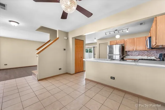 a kitchen with stainless steel appliances granite countertop a sink and cabinets