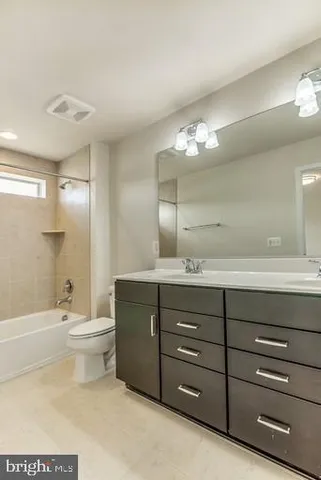 a bathroom with a sink a toilet and a bathtub