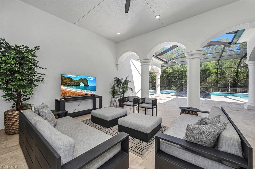6689 Hunters Road Naples, FL 34109 - Photo 14 of 35 a living room with furniture and a potted plant