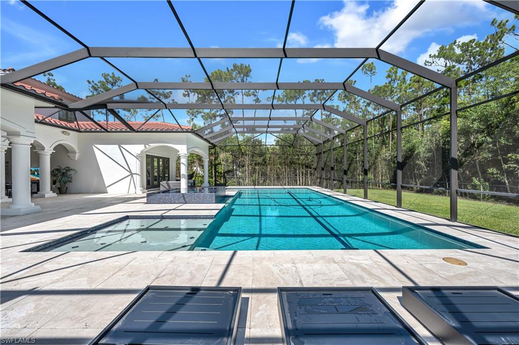 6689 Hunters Road Naples, FL 34109 - Photo 16 of 35 a view of a backyard with seating space