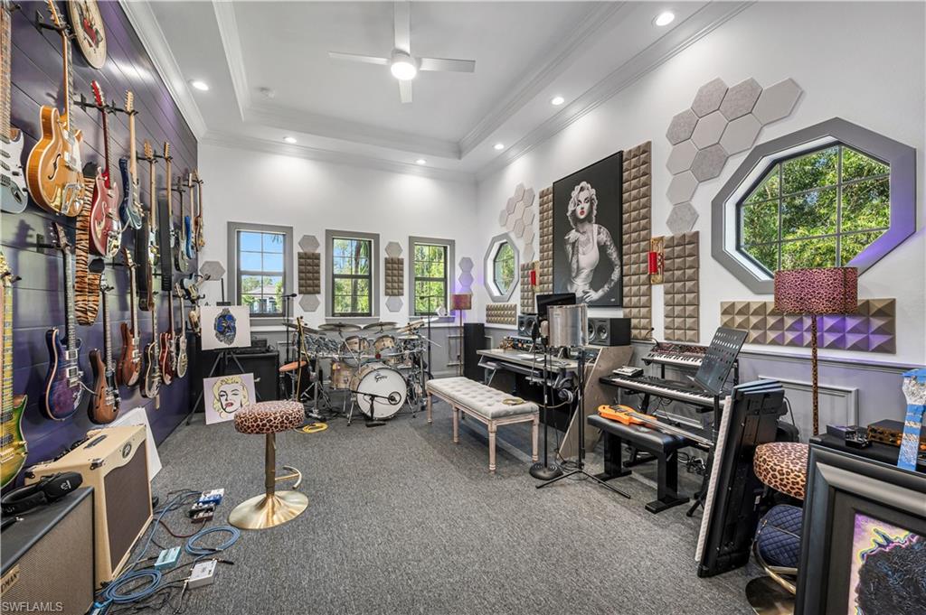 6689 Hunters Road Naples, FL 34109 - Photo 20 of 35 a living room with furniture and a fireplace