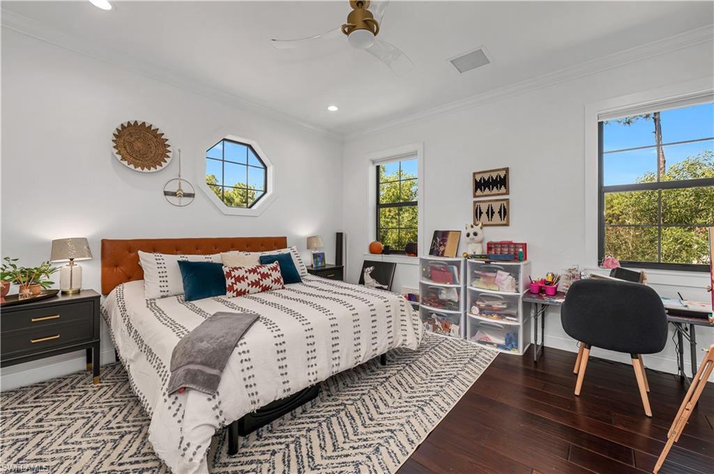 6689 Hunters Road Naples, FL 34109 - Photo 24 of 35 a bedroom with bed and a window