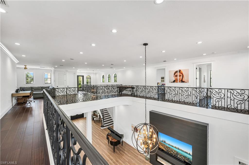 6689 Hunters Road Naples, FL 34109 - Photo 31 of 35 a kitchen with a table and chairs