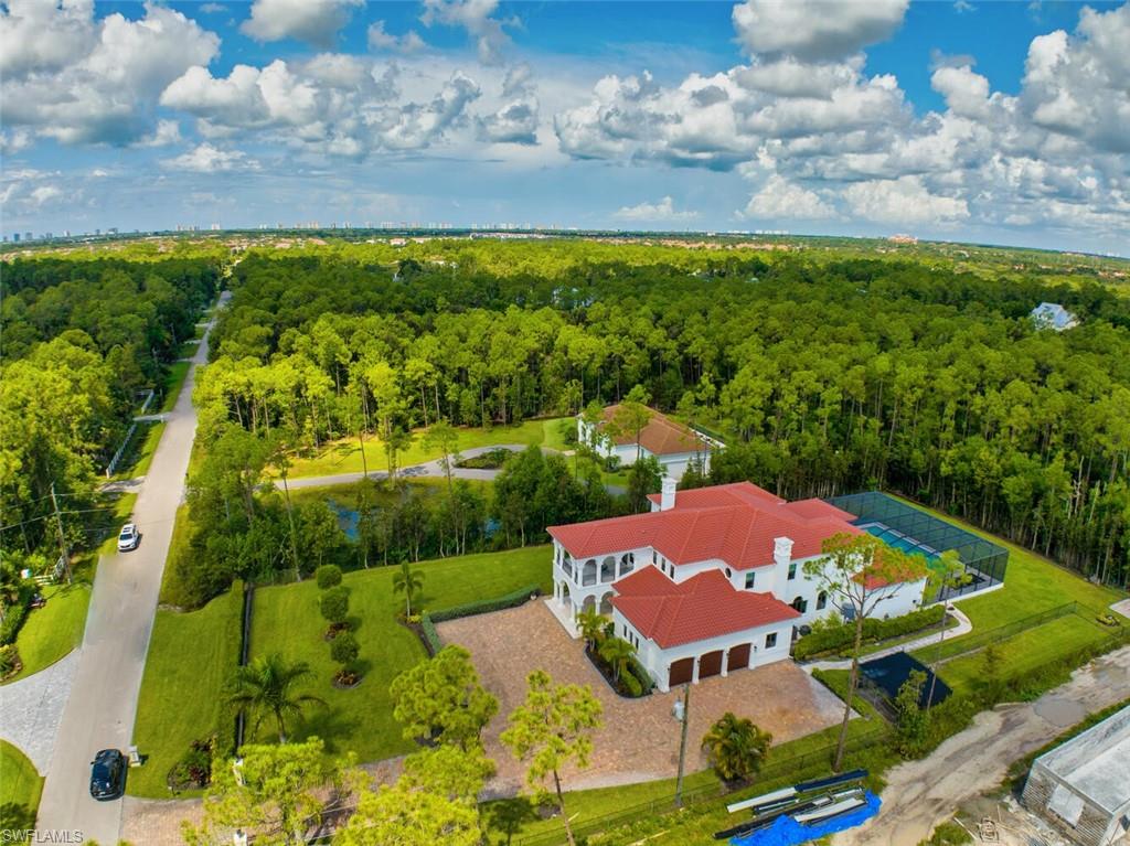 6689 Hunters Road Naples, FL 34109 - Photo 34 of 35 an aerial view of residential houses with outdoor space