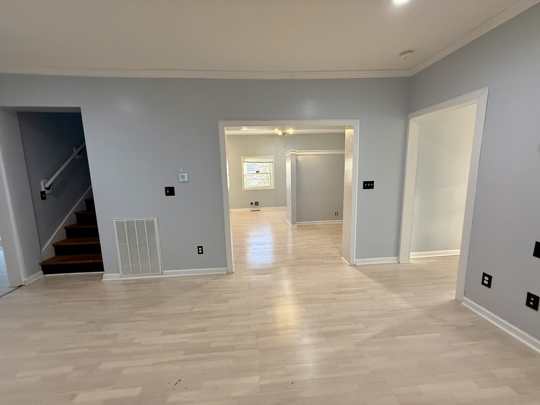 1116 Main Street Pleasant View, TN 37146 - Photo 12 of 29 a view of a livingroom with wooden floor and staircase