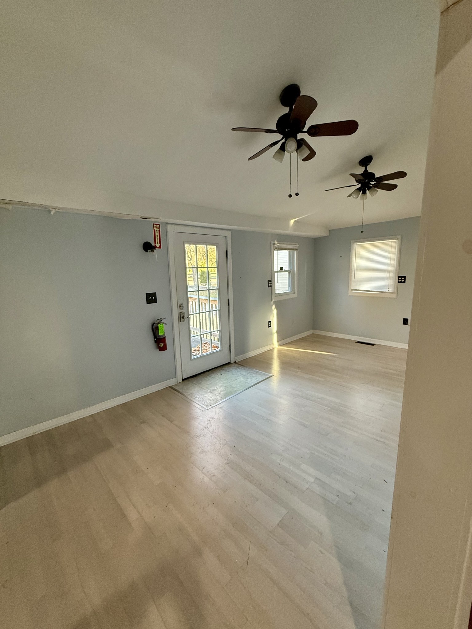 1116 Main Street Pleasant View, TN 37146 - Photo 2 of 29 wooden floor in an empty room with a window
