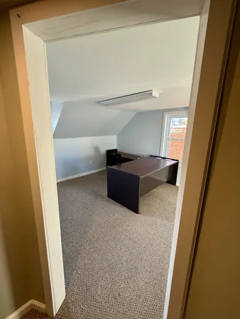 a view of an empty room and a window