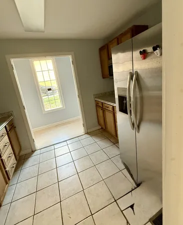a view of a hallway view with wooden floor and staircase