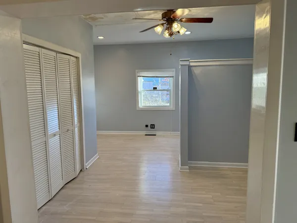 a view of a livingroom with wooden floor