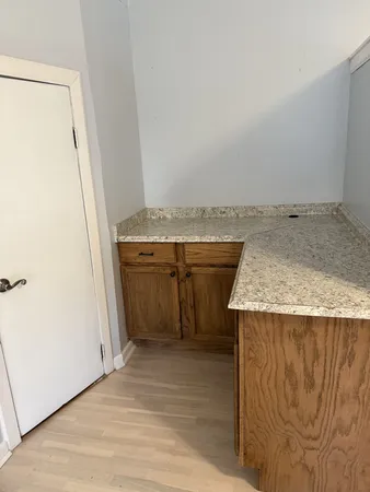 an empty room with windows and entrance