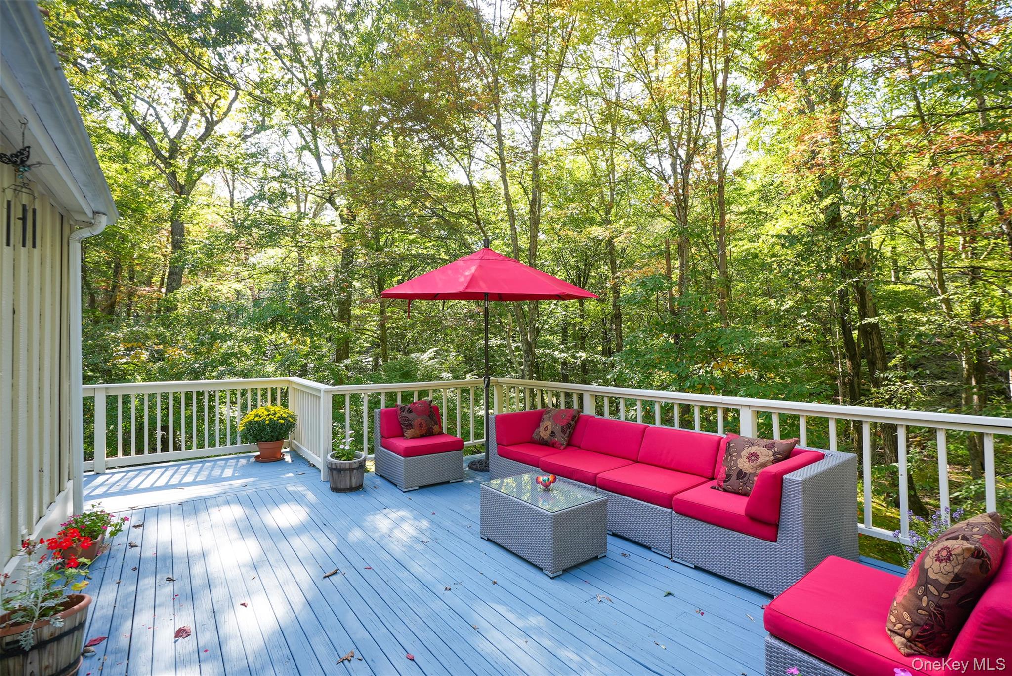 22 Peters Lane Pound Ridge, NY 10576 - Photo 36 of 43 Expansive outdoor deck with light blue wood-finish flooring and white railing
