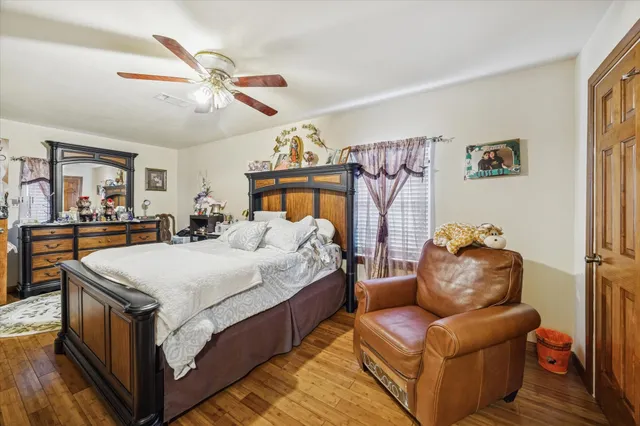 a bed room with a bed and a large mirror