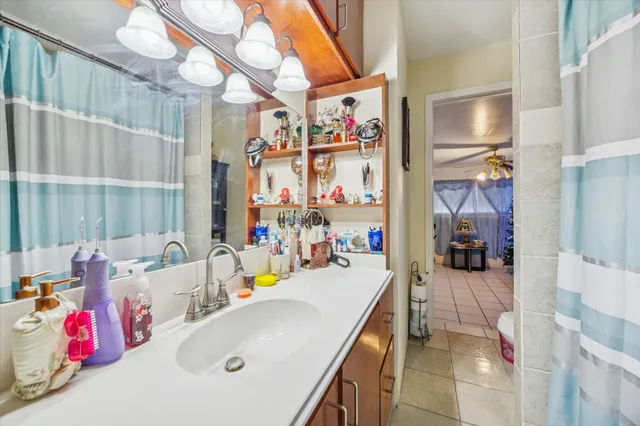 a bathroom with a sink a tub and shower