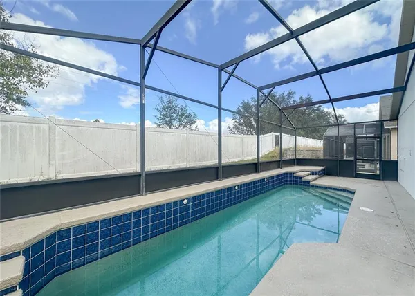 a view of a back yard of the house