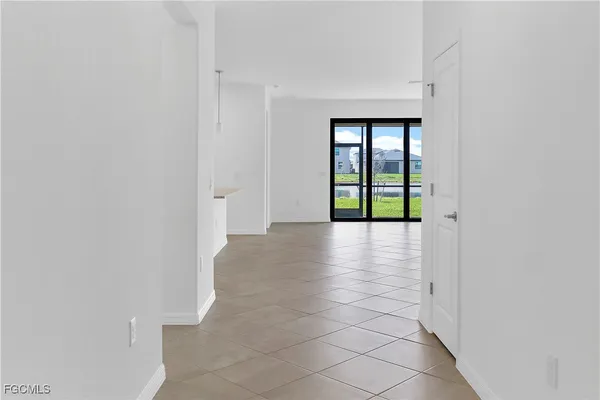 a bathroom with a granite countertop toilet and a sink