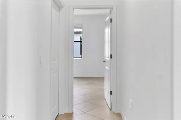 a bath tub sitting next to a white toilet and a sink