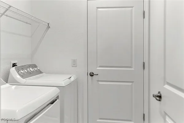 a kitchen with granite countertop a sink and a stove