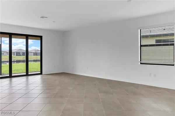 a kitchen with stainless steel appliances granite countertop a refrigerator a stove and a sink