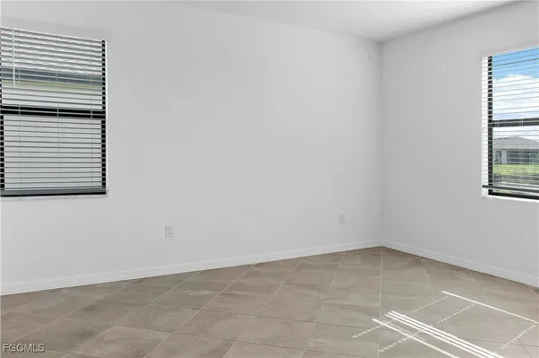 a view of a swimming pool with chairs