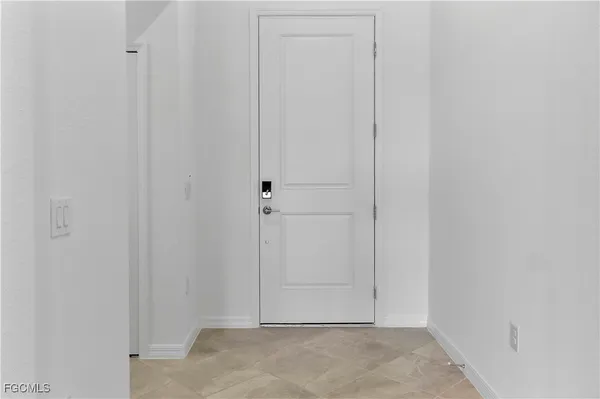 an empty room with closet area
