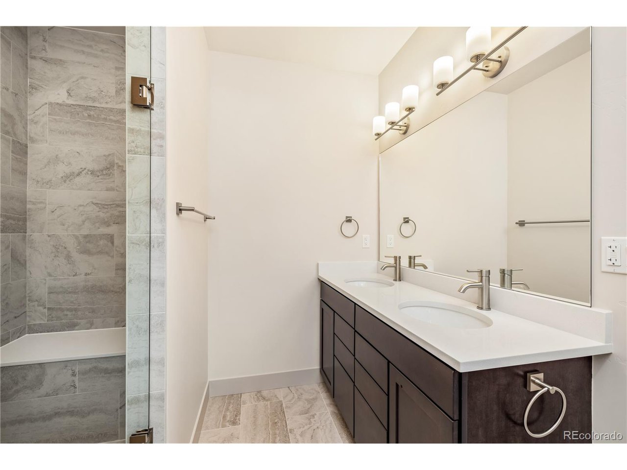 624 Montezuma Road, Unit 3 Keystone, CO 80435 - Photo 13 of 36 a bathroom with a sink a mirror and shower