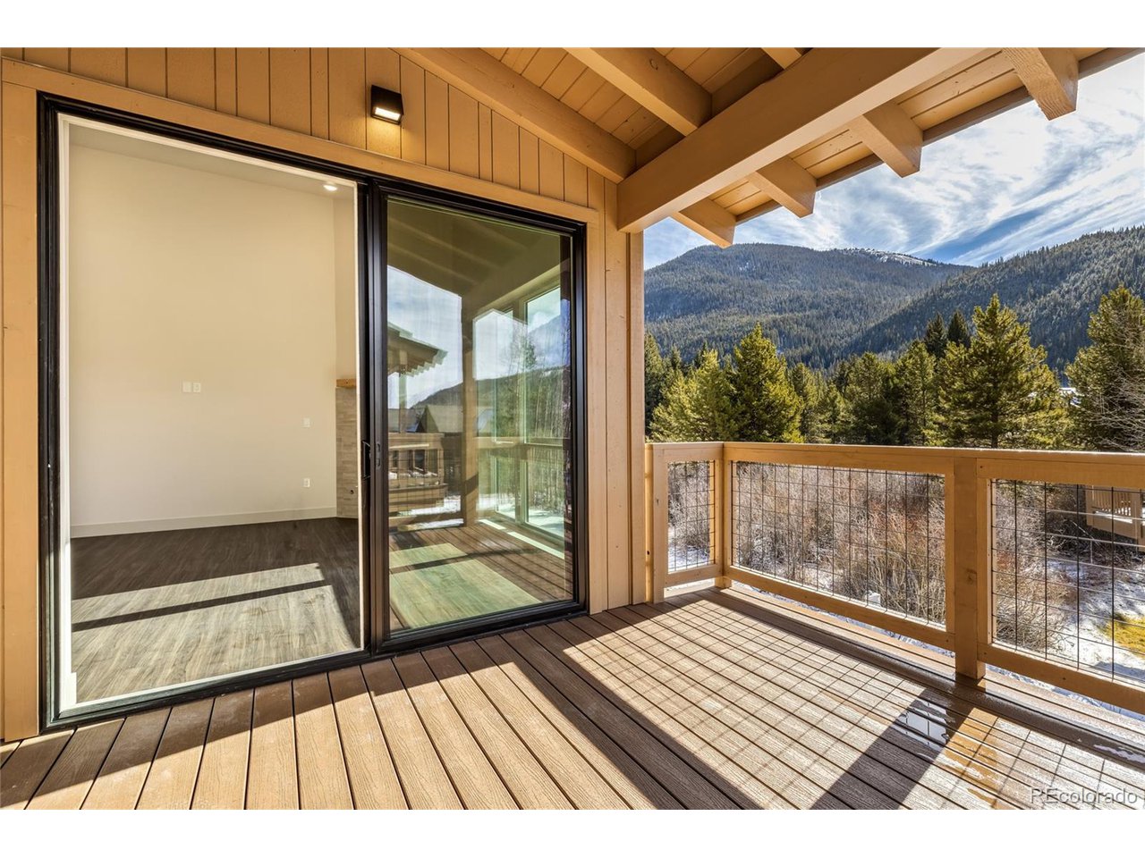 624 Montezuma Road, Unit 3 Keystone, CO 80435 - Photo 19 of 36 a view of balcony with wooden floor