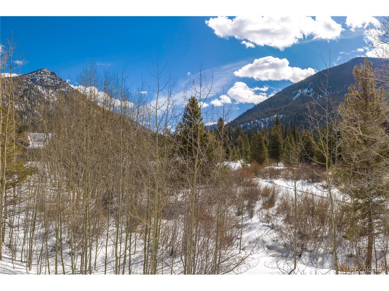 624 Montezuma Road, Unit 3 Keystone, CO 80435 - Photo 28 of 36 a view of a house with a yard