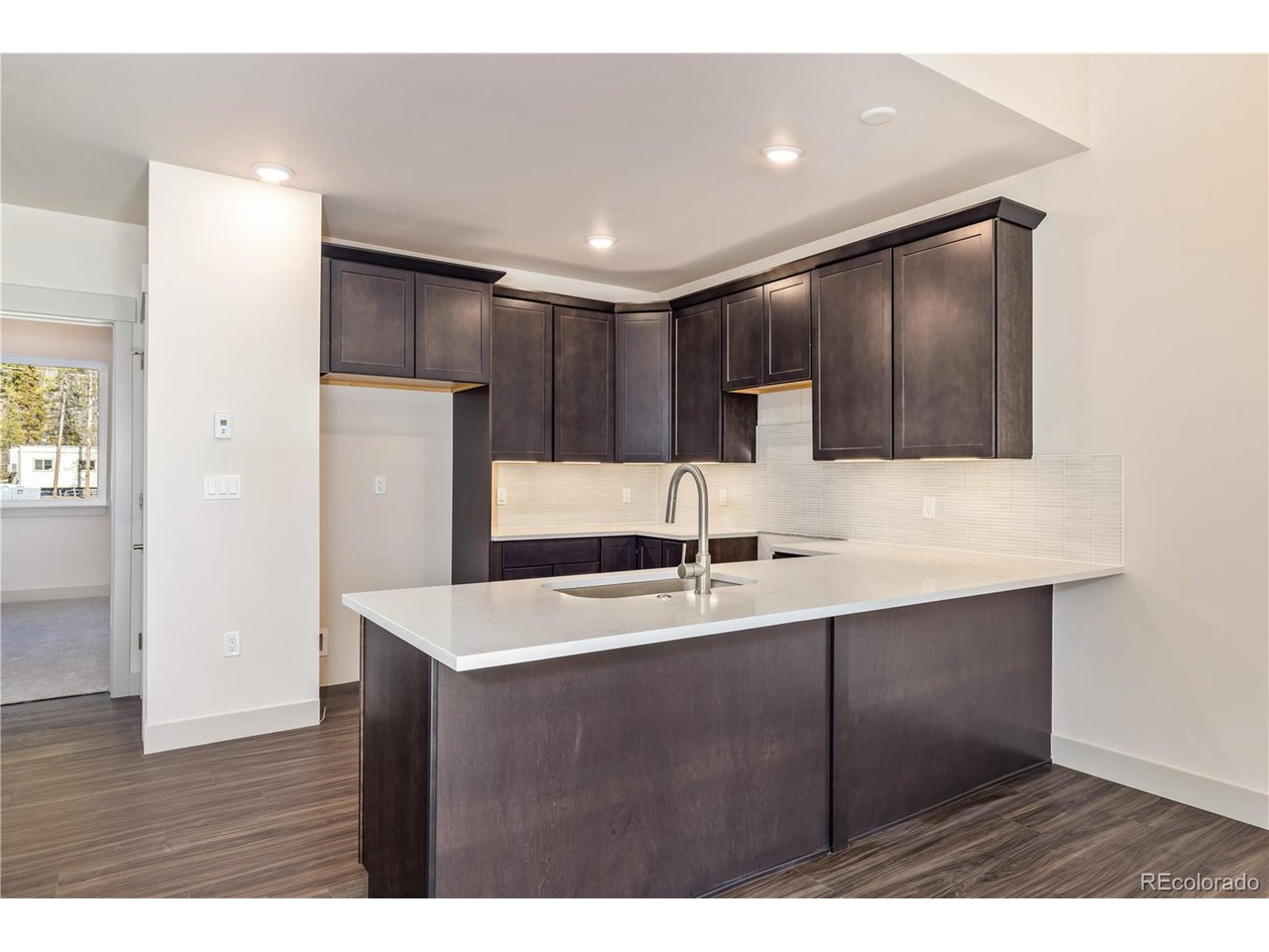 624 Montezuma Road, Unit 3 Keystone, CO 80435 - Photo 5 of 36 a kitchen with kitchen island a sink stainless steel appliances and cabinets