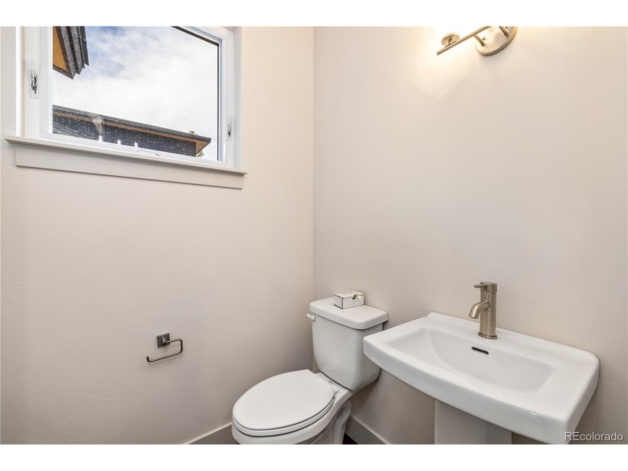 624 Montezuma Road, Unit 3 Keystone, CO 80435 - Photo 9 of 36 a bathroom with a toilet a sink and mirror