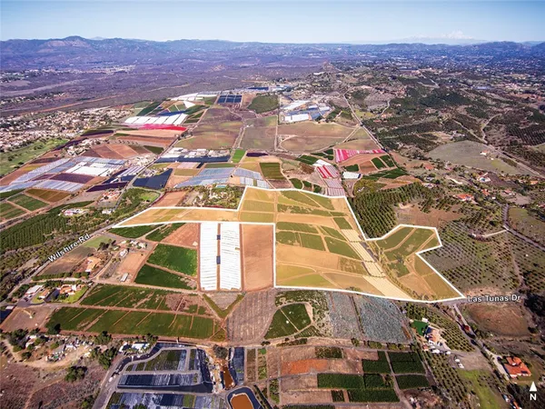 an aerial view of residential houses and street