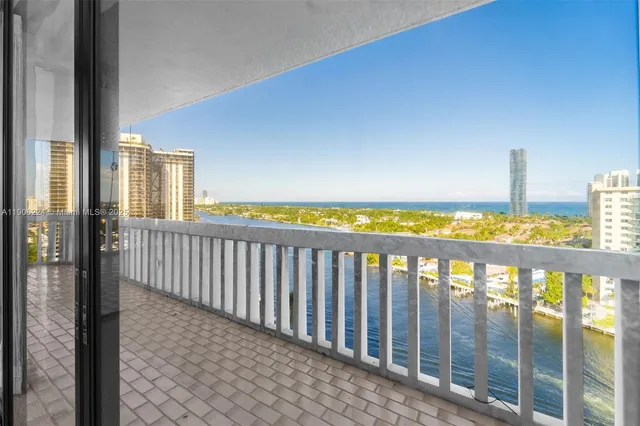 a view of a balcony with wooden floor