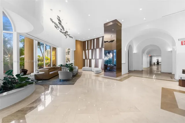 a view of a livingroom with furniture and windows