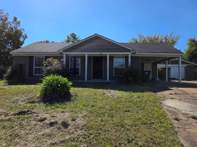 front view of a house with a yard