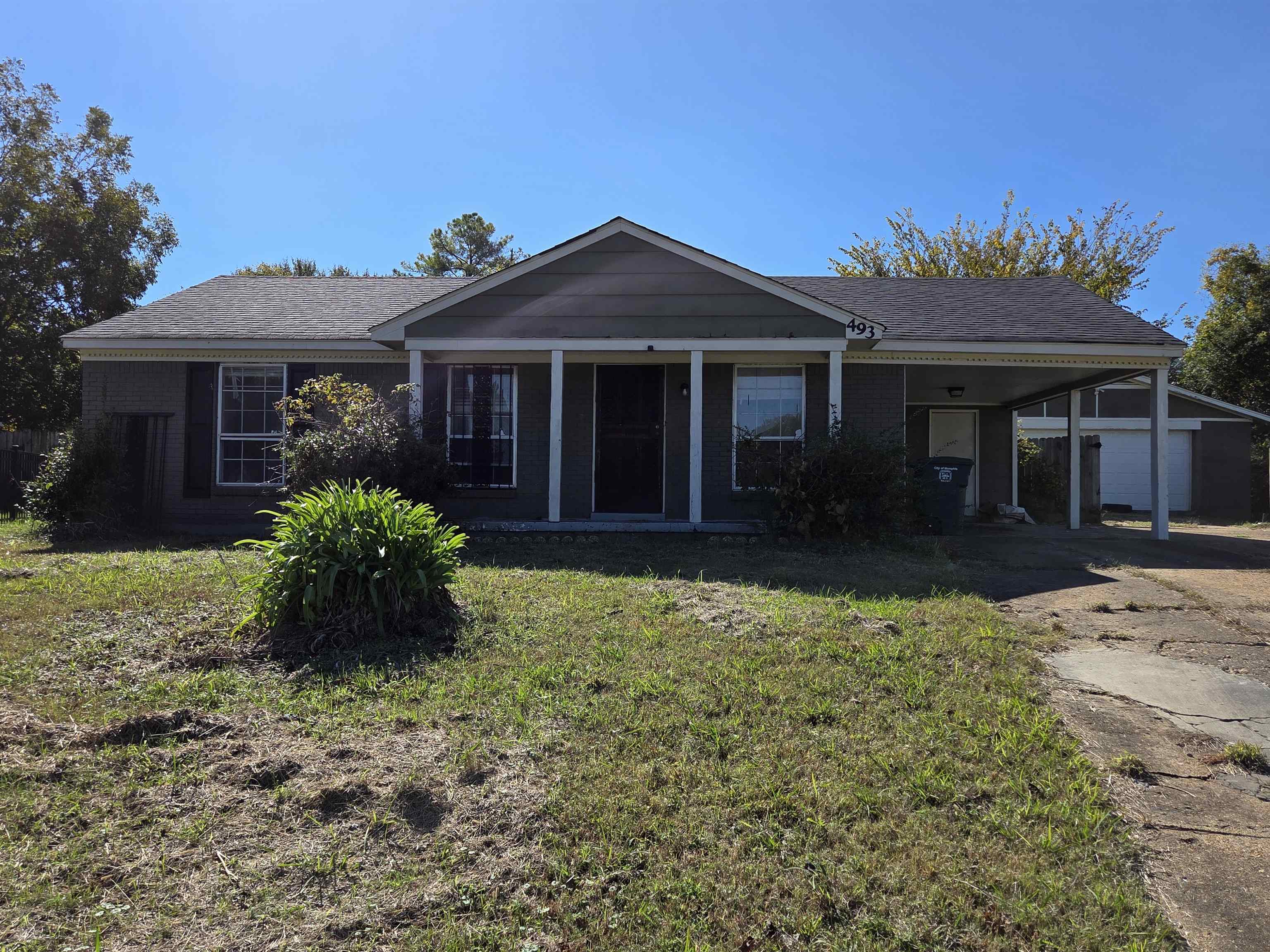 front view of a house with a yard